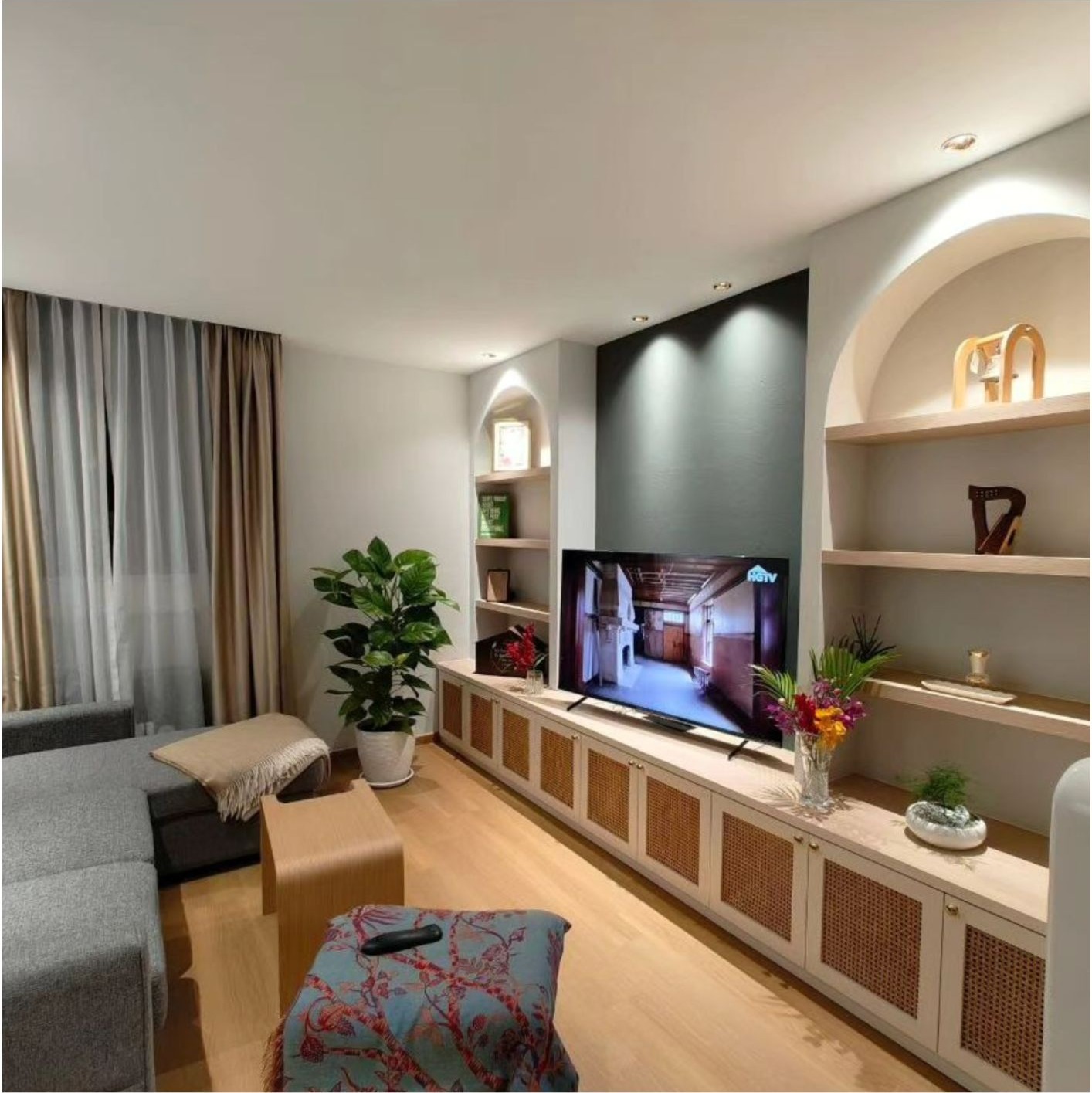Scandinavian country living room with rattan TV console, arched niches and warm wood floor in Bishan HDB