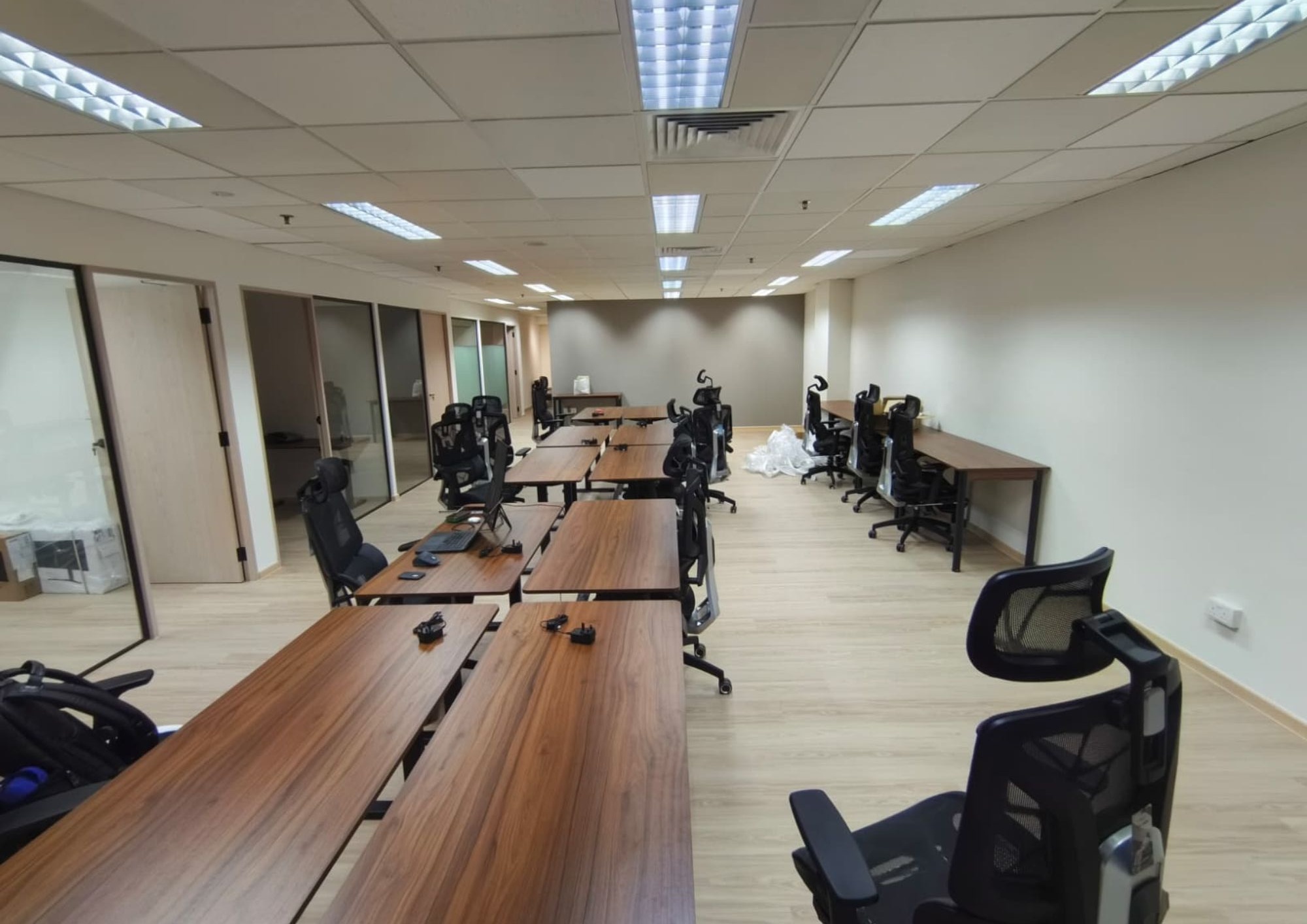 Built-in carpentry with long timber work desks at Fortress Law Corporation office